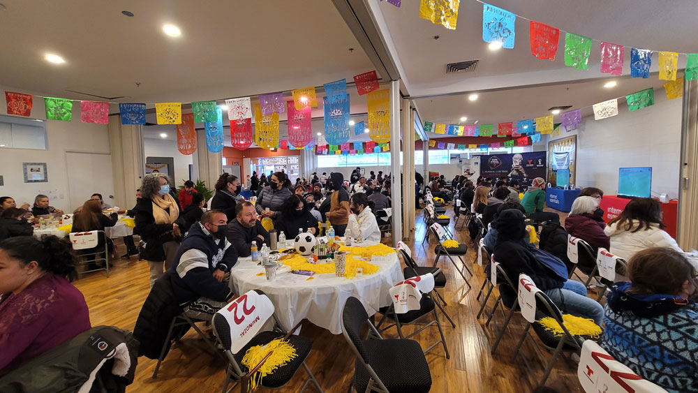 A large festive celebration full of Encuentro community members
