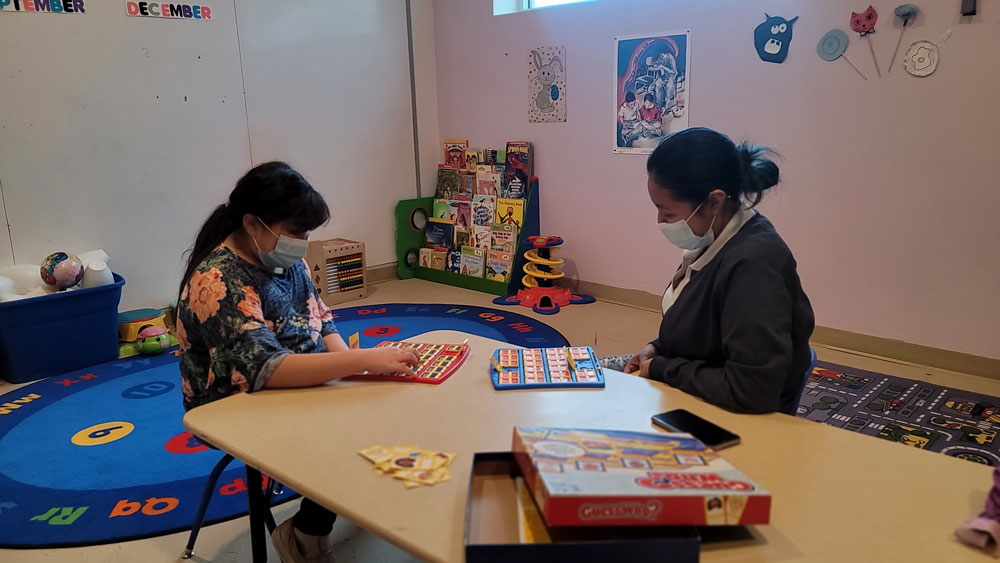 Encuentro team members in a child nursery space
